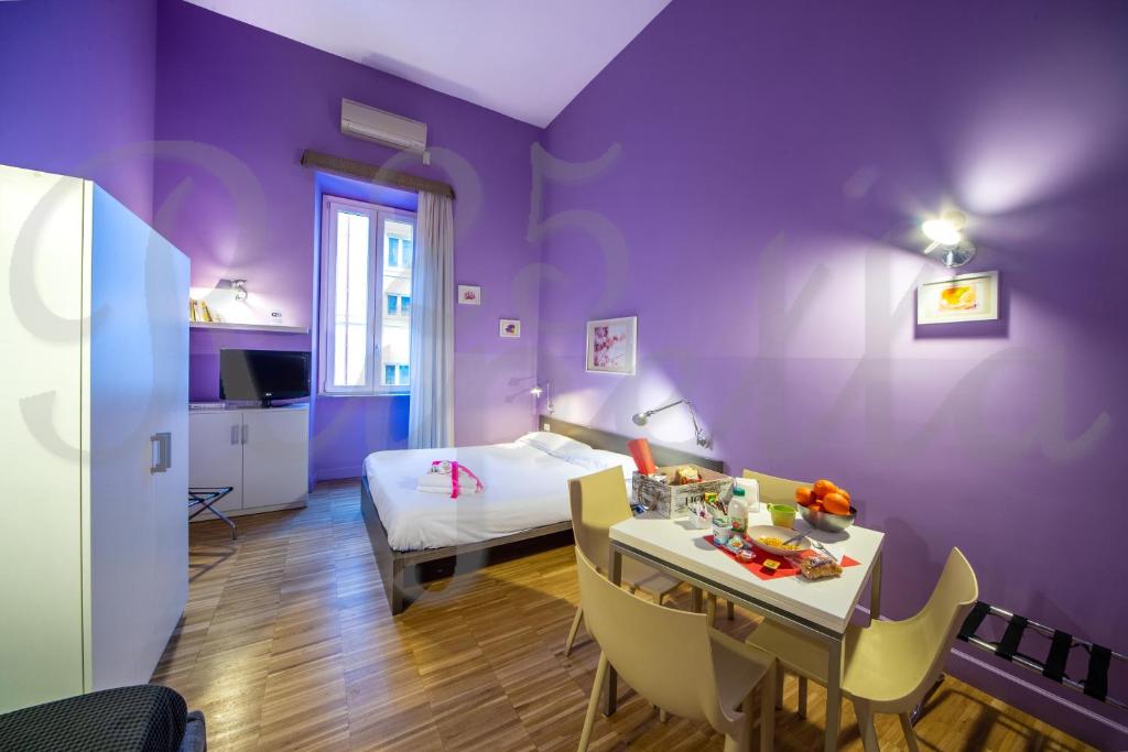 Voodi või voodid majutusasutuse Ripetta 25 Prestige Rooms toas