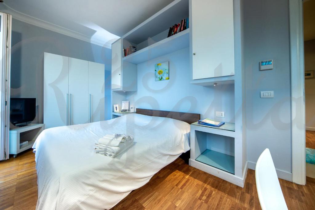 Voodi või voodid majutusasutuse Ripetta 25 Prestige Rooms toas