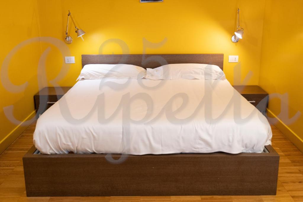 Voodi või voodid majutusasutuse Ripetta 25 Prestige Rooms toas