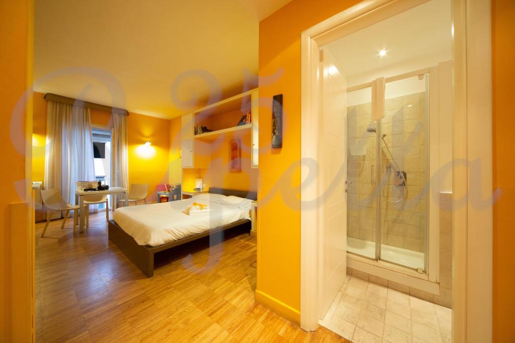 a hotel room with a bed and a bathroom at Ripetta 25 Prestige Rooms in Rome