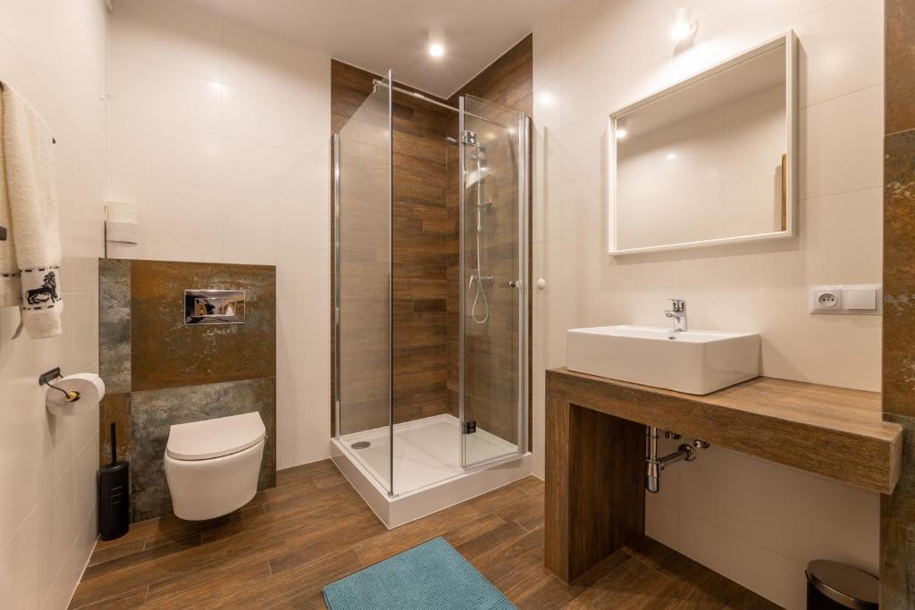 Kúpeľňa v ubytovaní Villa Gromadzyń