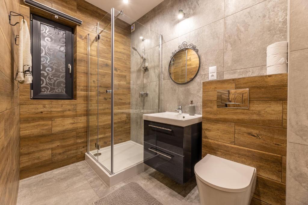 Kúpeľňa v ubytovaní Villa Gromadzyń