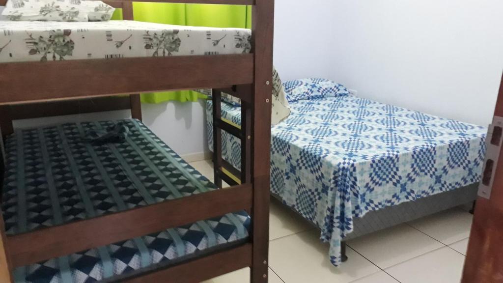 Postel nebo postele na pokoji v ubytování Hospedagem Flor de Araca