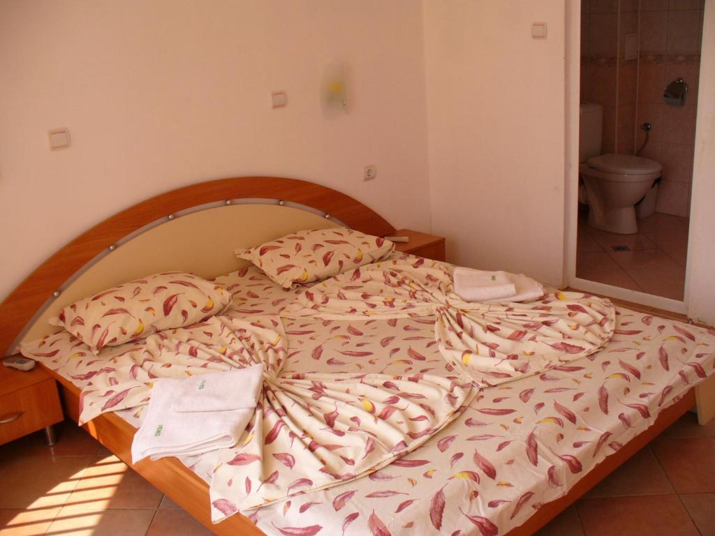 Postel nebo postele na pokoji v ubytování VENIS hotel