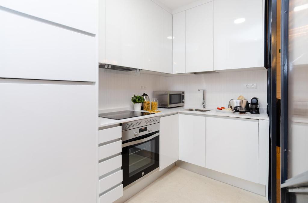 Kuchyň nebo kuchyňský kout v ubytování Palacio Premium Stay