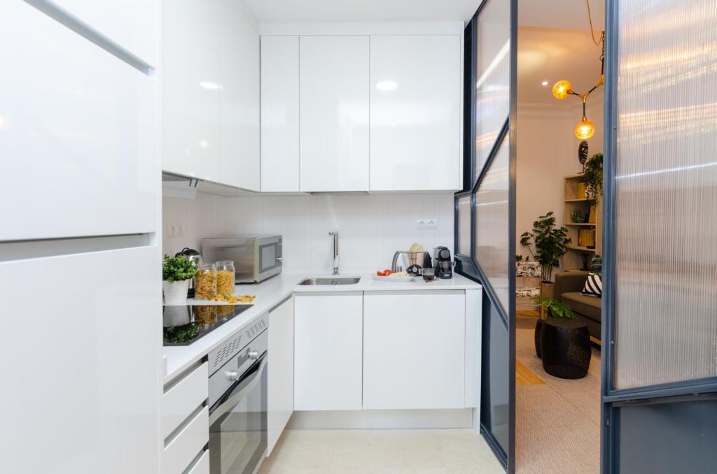 Kuchyň nebo kuchyňský kout v ubytování Palacio Premium Stay