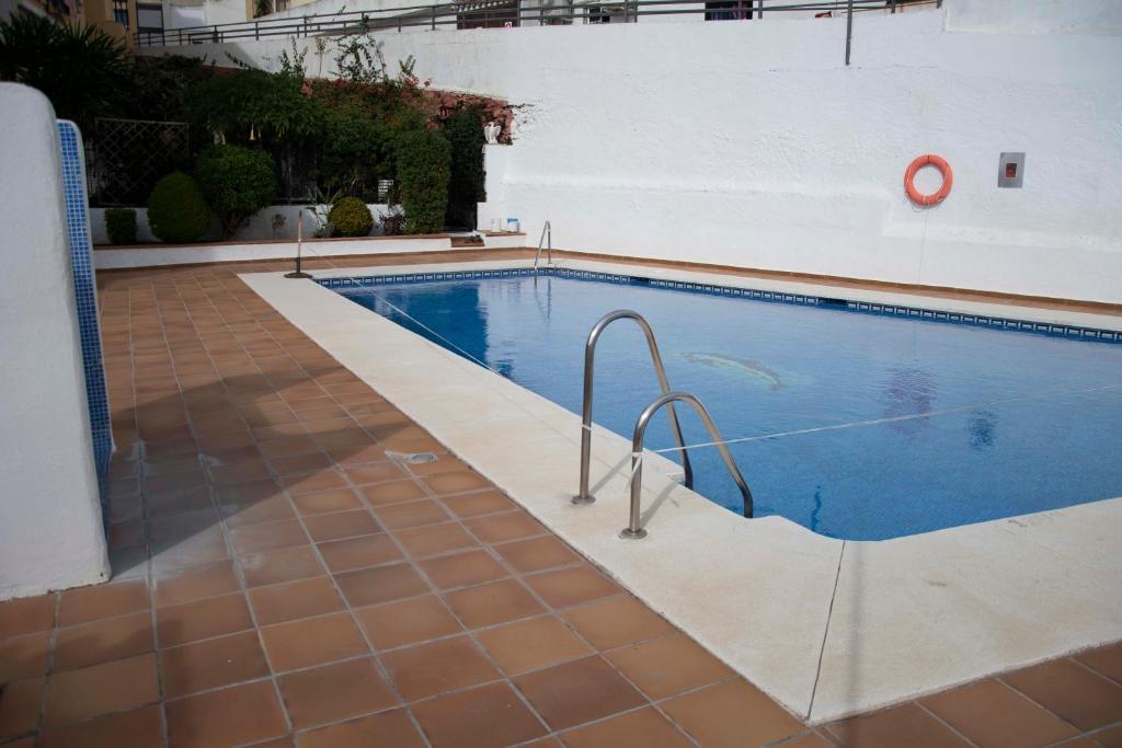 Bazén v ubytovaní MONKÓ - ROSARIO APARTMENT BEACH & SUN o alebo v jeho blízkosti