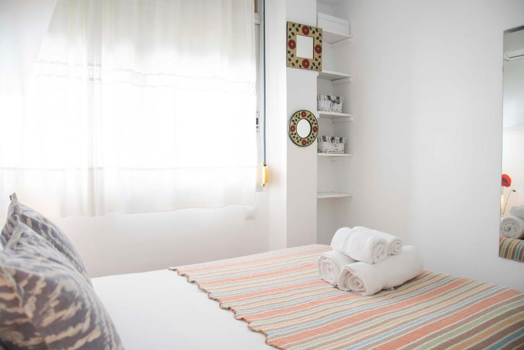 Posteľ alebo postele v izbe v ubytovaní MONKÓ - ROSARIO APARTMENT BEACH & SUN o