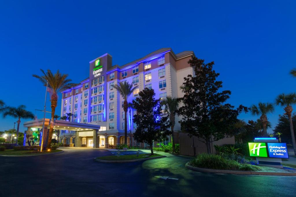 a rendering of a hotel at night at Holiday Inn Express & Suites S Lake Buena Vista by IHG in Kissimmee