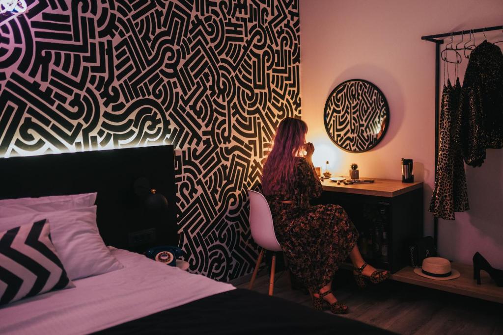Postel nebo postele na pokoji v ubytování Hotel Marienplatz Podgorica