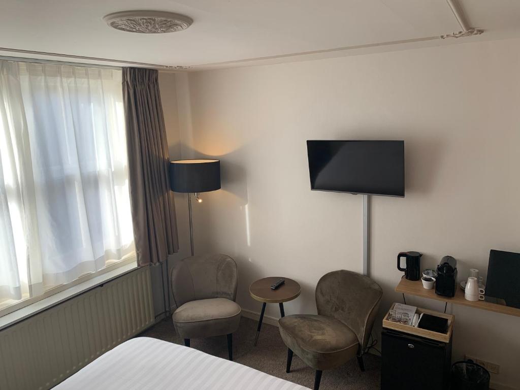 TV a/nebo společenská místnost v ubytování Hotel Grand Canal
