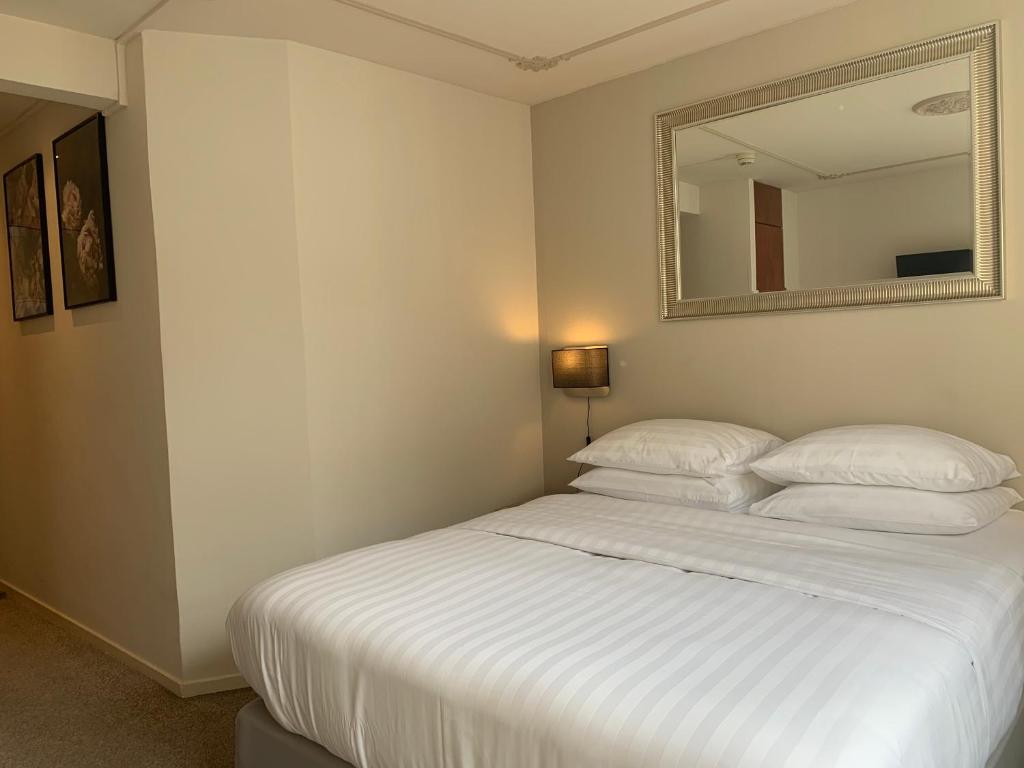 Postel nebo postele na pokoji v ubytování Hotel Grand Canal