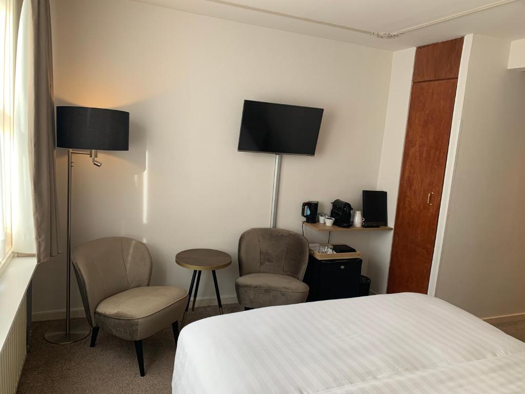 TV a/nebo společenská místnost v ubytování Hotel Grand Canal