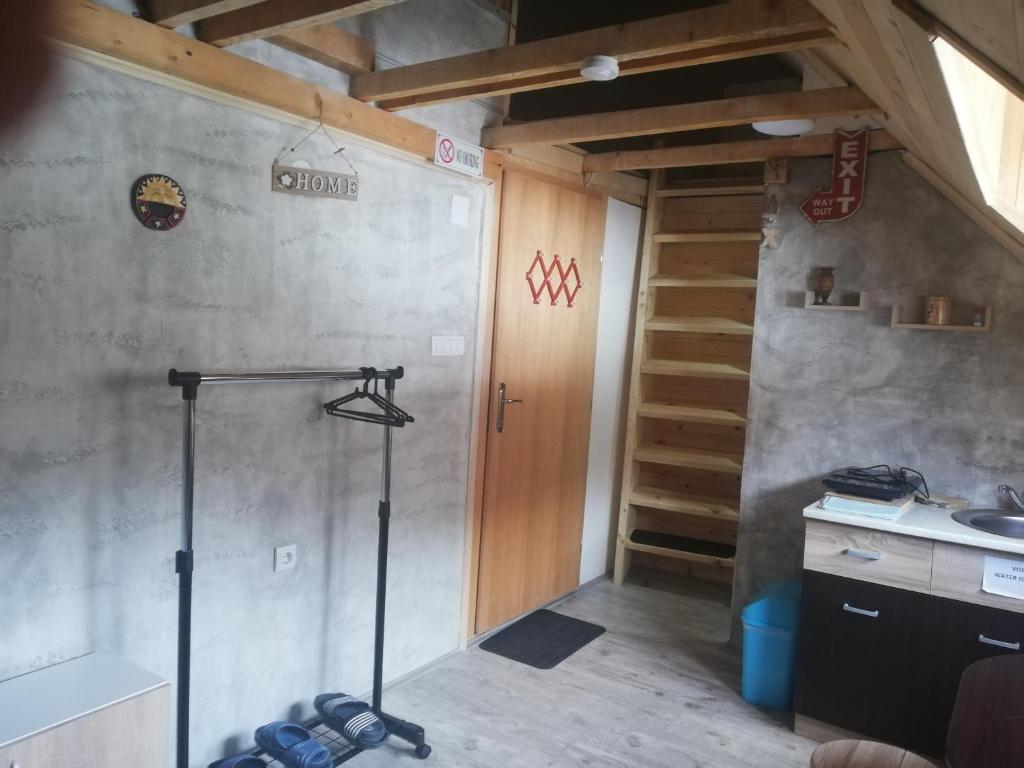 a room with a treadmill in the corner of a room at Athos mountain in Crni Vrh