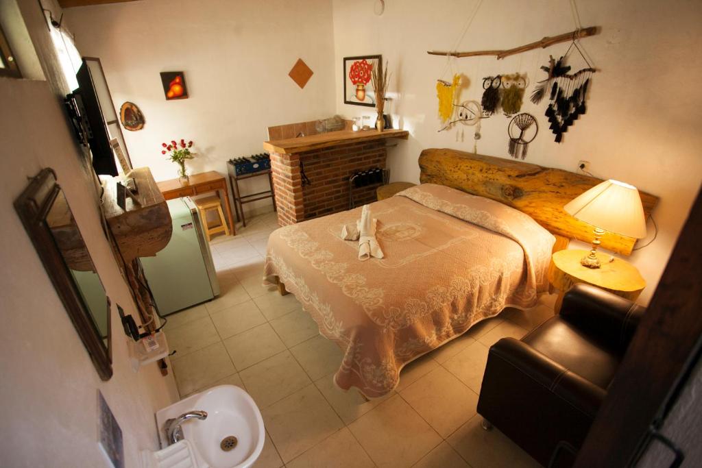 Postel nebo postele na pokoji v ubytování Htl & Villas Las Glorias Mazamitla, céntricas, parking, jardín