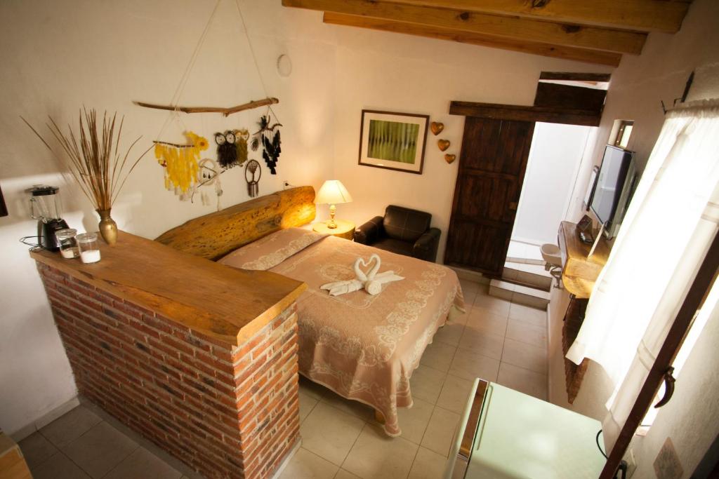 Postel nebo postele na pokoji v ubytování Htl & Villas Las Glorias Mazamitla, céntricas, parking, jardín