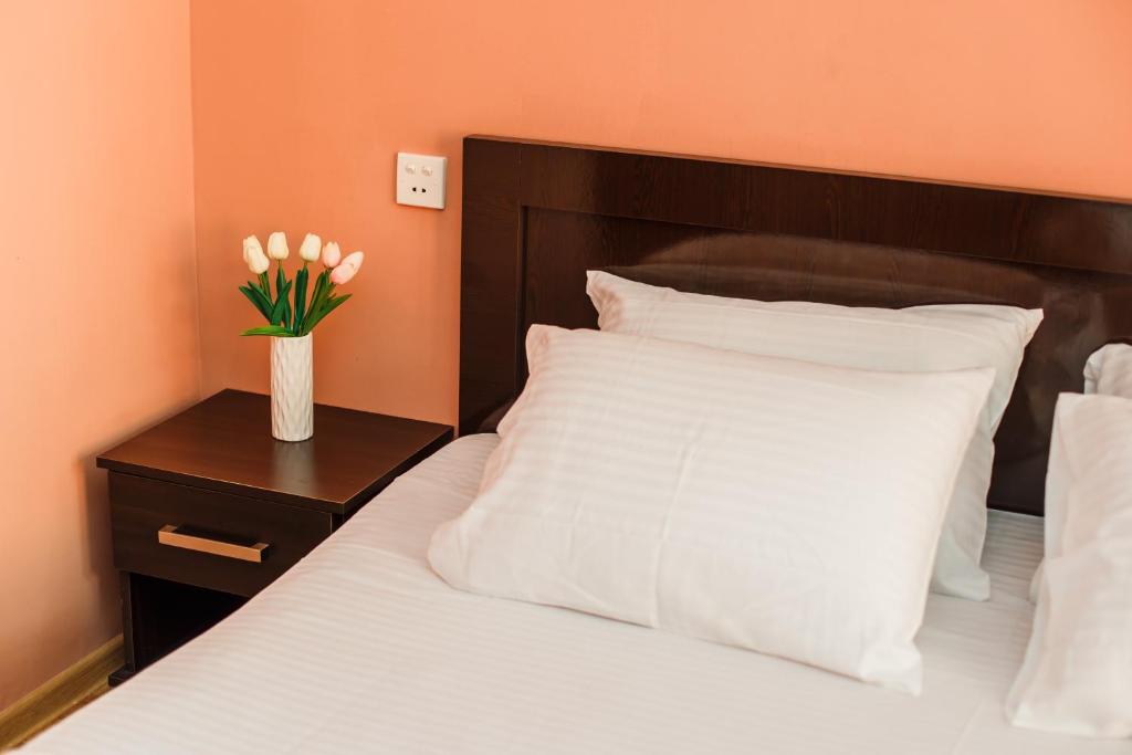Postel nebo postele na pokoji v ubytování Hotel Egrisi