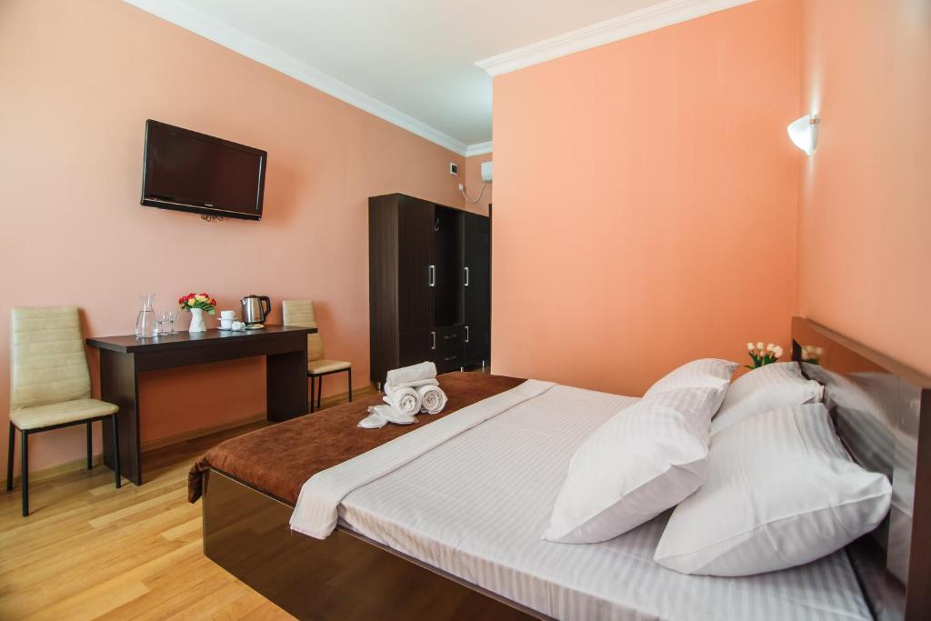 Postel nebo postele na pokoji v ubytování Hotel Egrisi