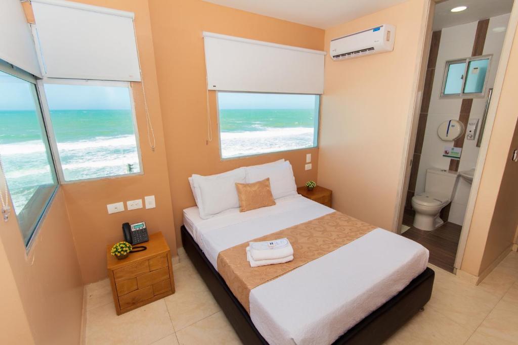 Postel nebo postele na pokoji v ubytování Hotel Aixo Suites By GEH Suites