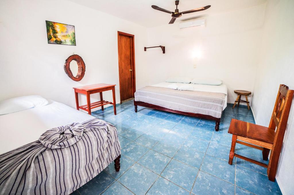Postel nebo postele na pokoji v ubytování Hotel el Manglar