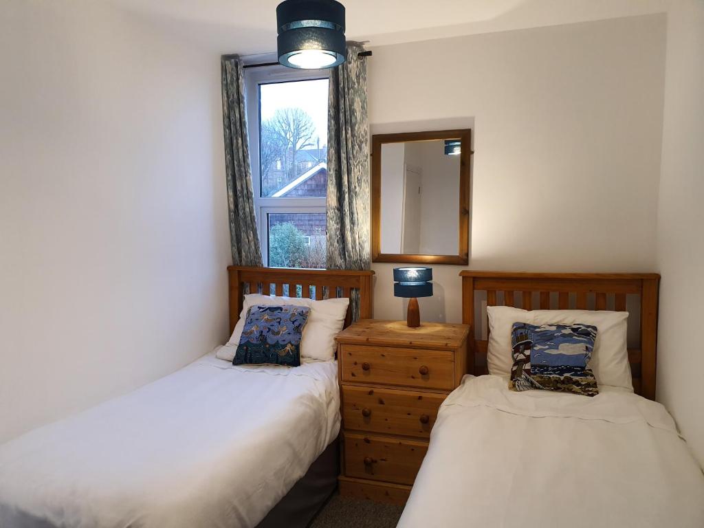 Postel nebo postele na pokoji v ubytování Summerhill Apartments