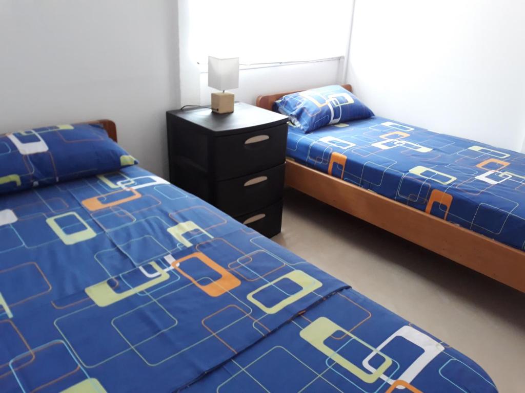 Postel nebo postele na pokoji v ubytování Hotel Almond Beach
