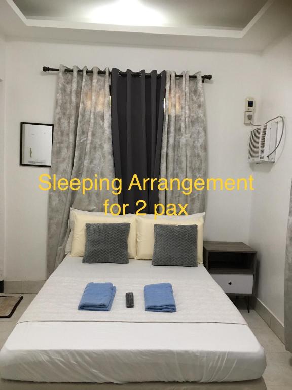 Postel nebo postele na pokoji v ubytování Bolinao Transient House B