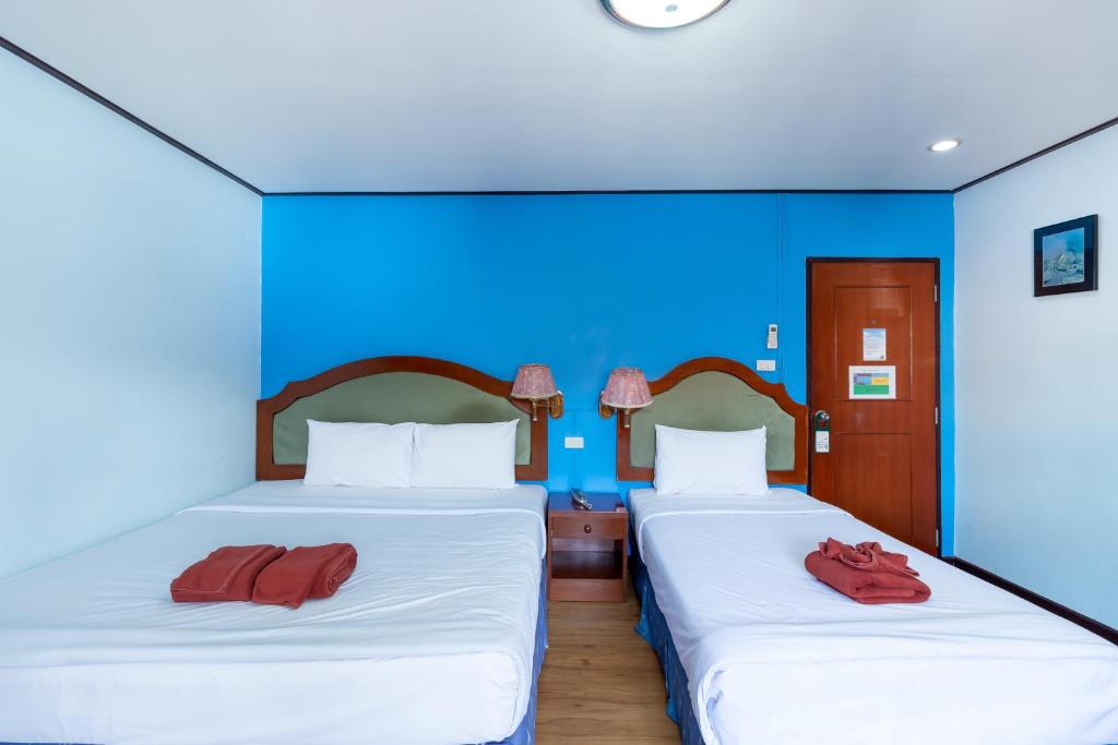 Postel nebo postele na pokoji v ubytování Thipurai Annex Hotel