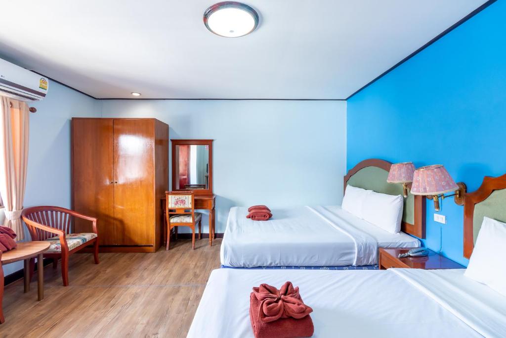 Postel nebo postele na pokoji v ubytování Thipurai Annex Hotel