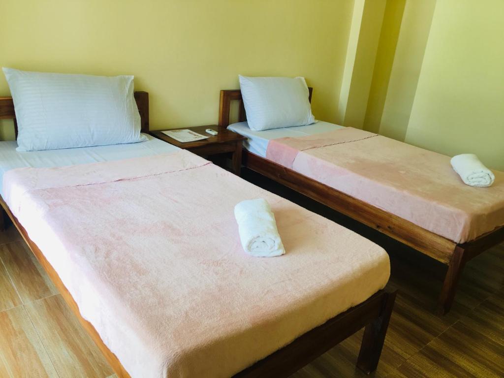 Postel nebo postele na pokoji v ubytování Shat's Guest House
