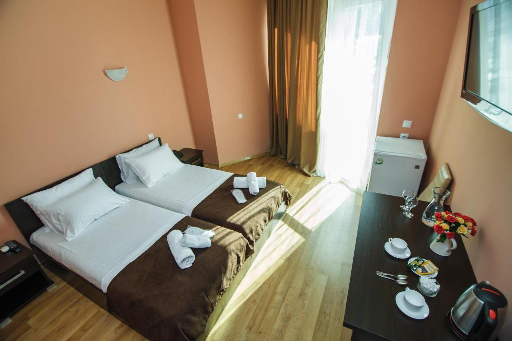 Postel nebo postele na pokoji v ubytování Hotel Egrisi