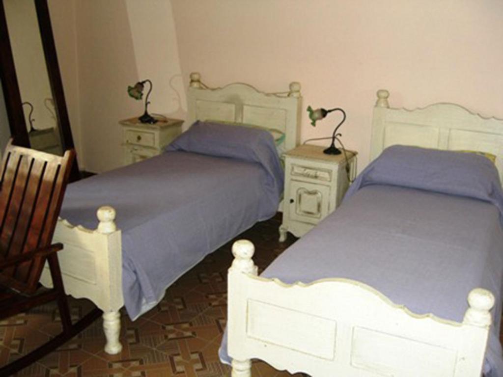 Postel nebo postele na pokoji v ubytování B&B Acetaia Il Mulino Di Navicello