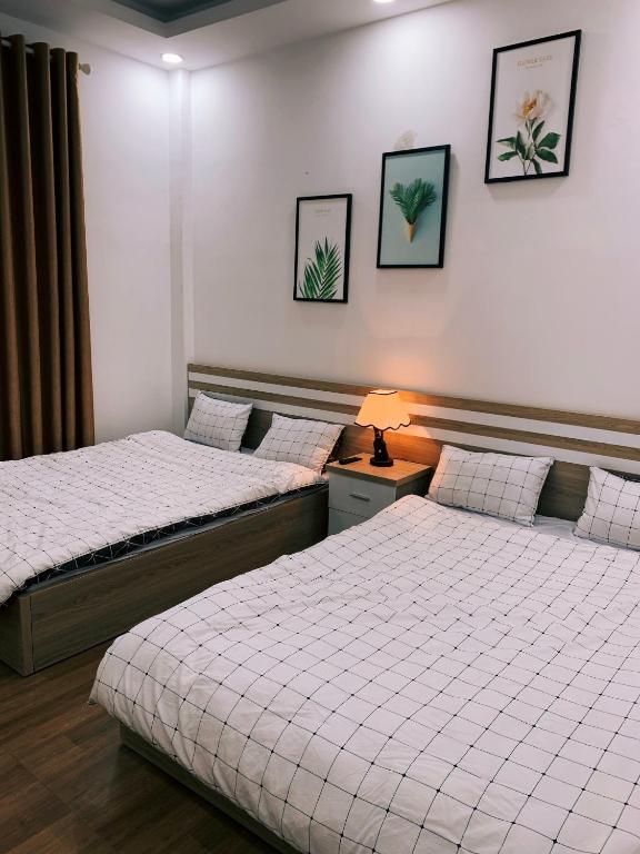 Postel nebo postele na pokoji v ubytování Trang Nguyen House