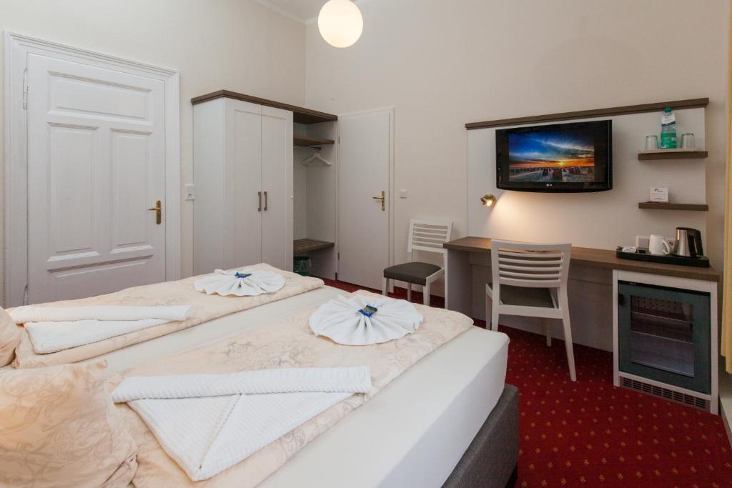 Postel nebo postele na pokoji v ubytování Hotel Weisse Düne