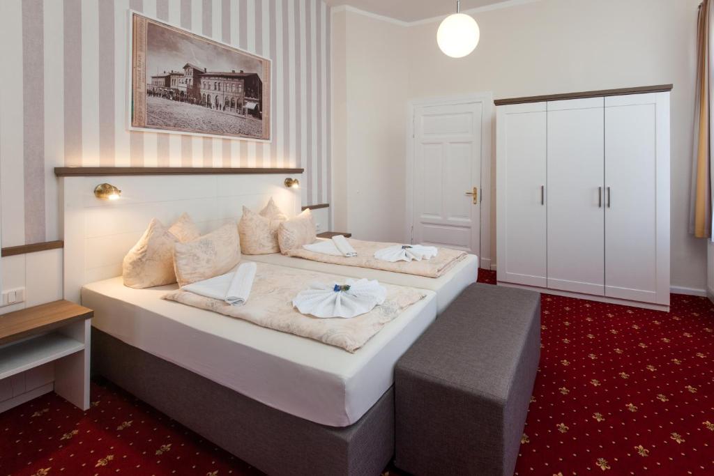 Postel nebo postele na pokoji v ubytování Hotel Weisse Düne