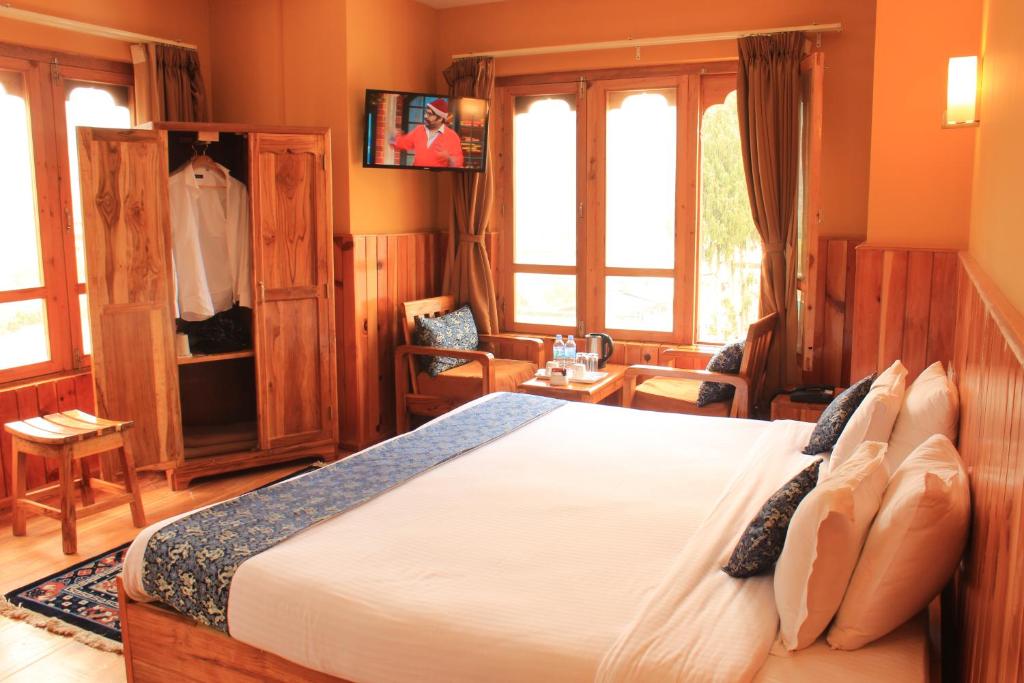 Postel nebo postele na pokoji v ubytování Hotel Khamsum