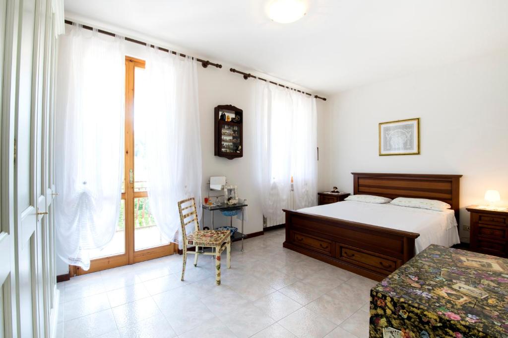 Postel nebo postele na pokoji v ubytování B&B VILLA GINEVRA
