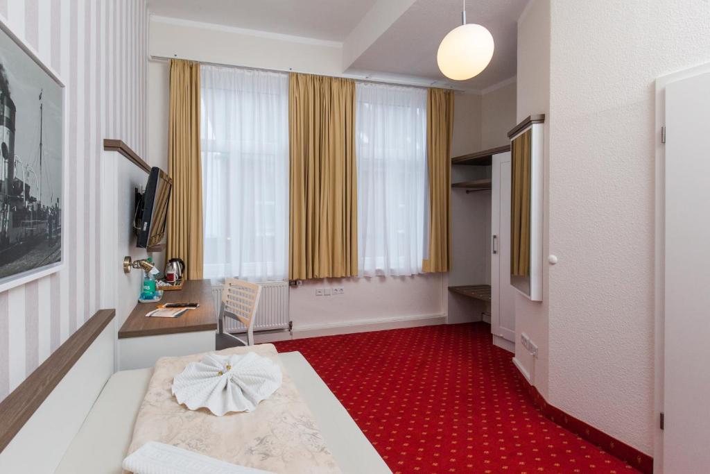 TV a/nebo společenská místnost v ubytování Hotel Weisse Düne