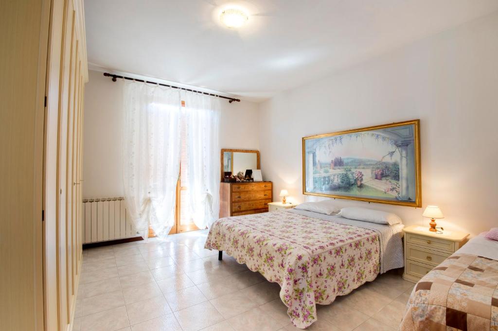 Postel nebo postele na pokoji v ubytování B&B VILLA GINEVRA