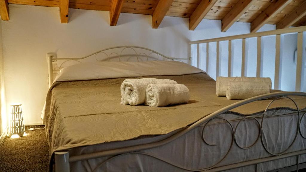 Postel nebo postele na pokoji v ubytování Casa Di Rosse