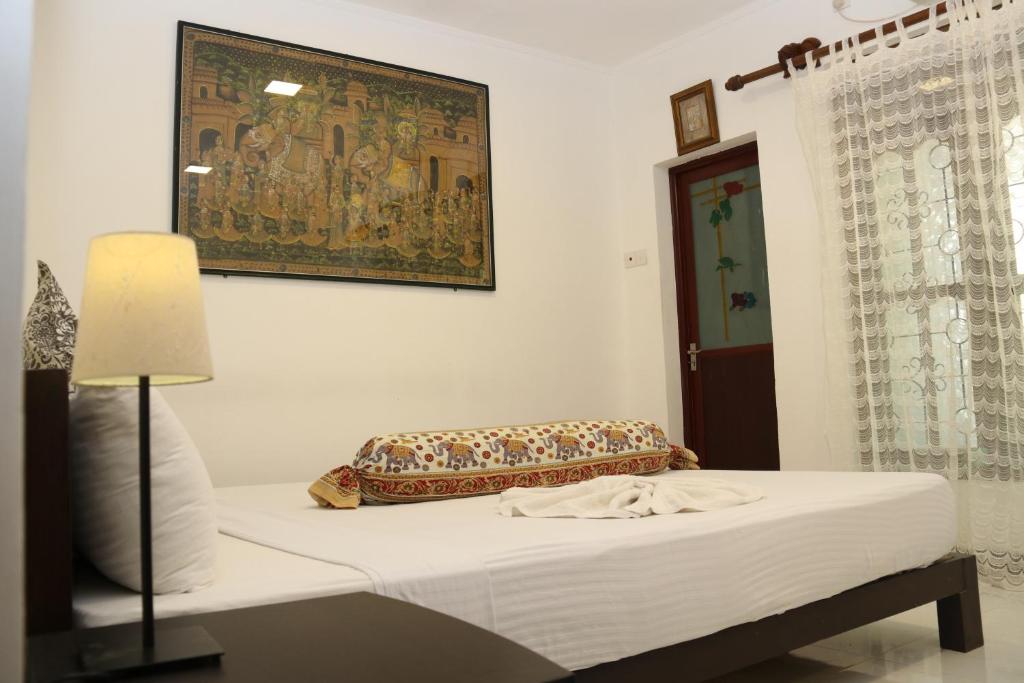 Postel nebo postele na pokoji v ubytování Thal Sewana Home Stay