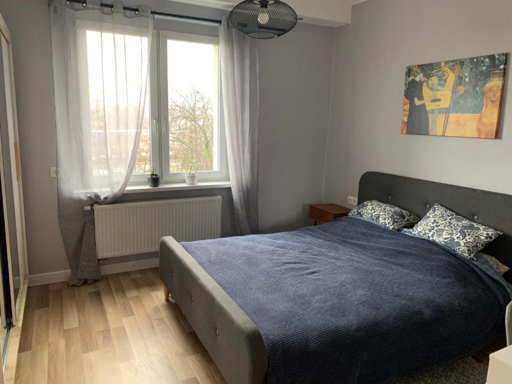 Posteľ alebo postele v izbe v ubytovaní Apartament „Ogrodowa”