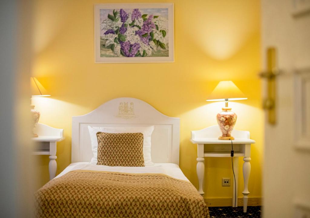 Postel nebo postele na pokoji v ubytování Hotel Gutenbergs