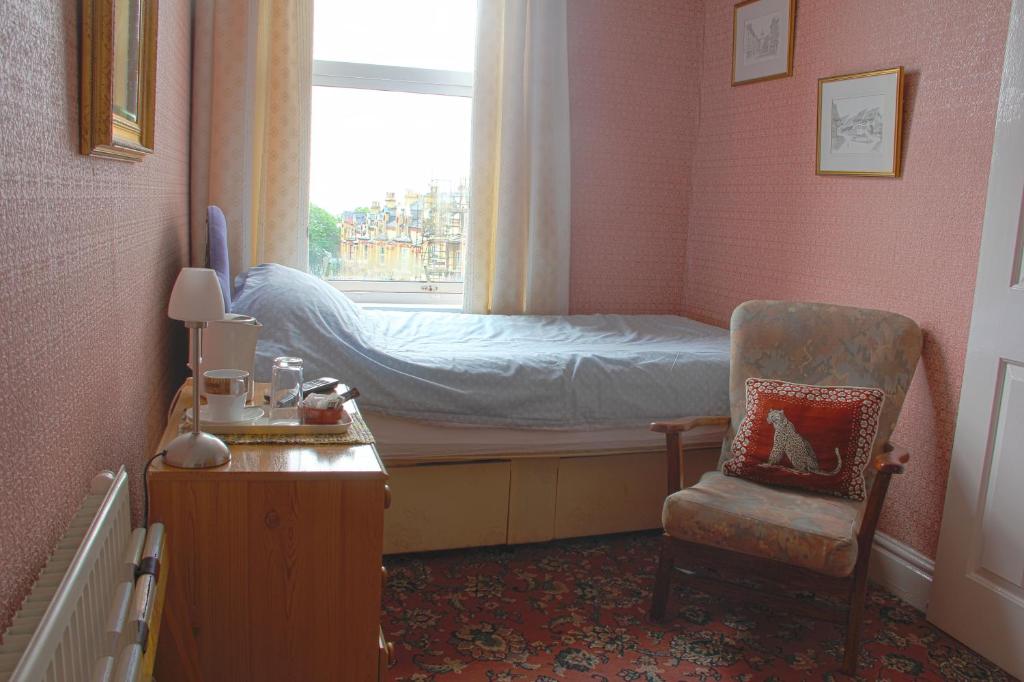 Postel nebo postele na pokoji v ubytování Ashfield Guesthouse