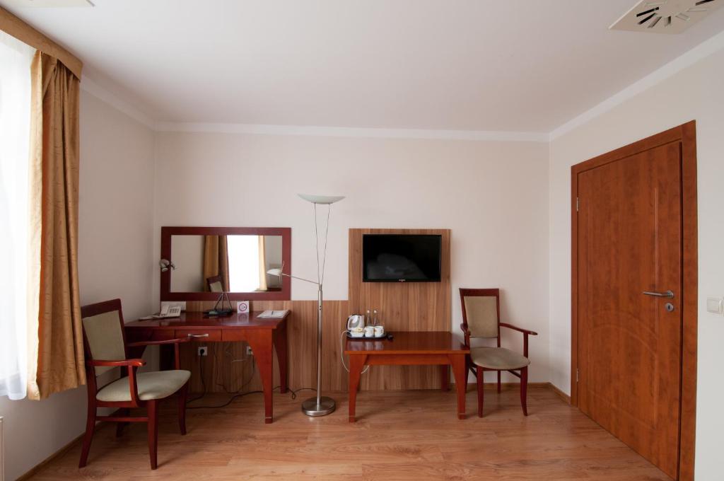 Televízia a/alebo spoločenská miestnosť v ubytovaní Hotel Nest