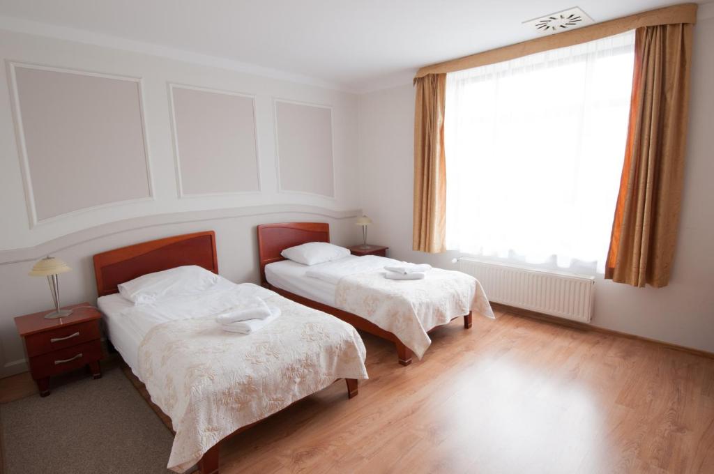 Posteľ alebo postele v izbe v ubytovaní Hotel Nest
