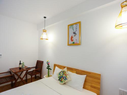 Postel nebo postele na pokoji v ubytování Star Garden Hoi An