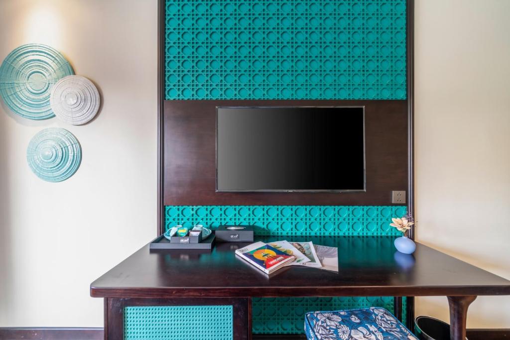 TV a/nebo společenská místnost v ubytování De An Hotel