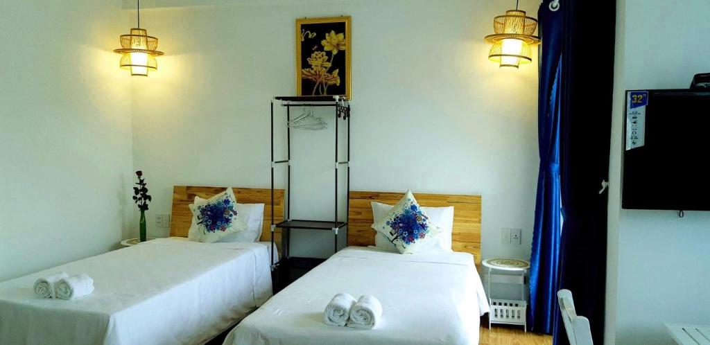 Postel nebo postele na pokoji v ubytování Star Garden Hoi An