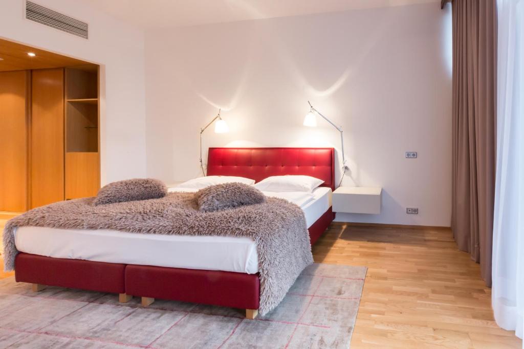 Postel nebo postele na pokoji v ubytování Das Sonnreich - Thermenhotel Loipersdorf